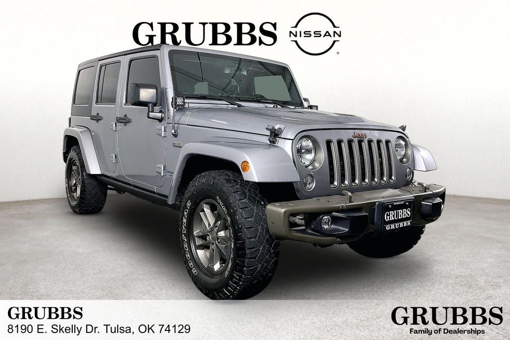 2016 Jeep Wrangler Unlimited Sahara in Billet Silver Metallic Clearcoat — front three-quarter view