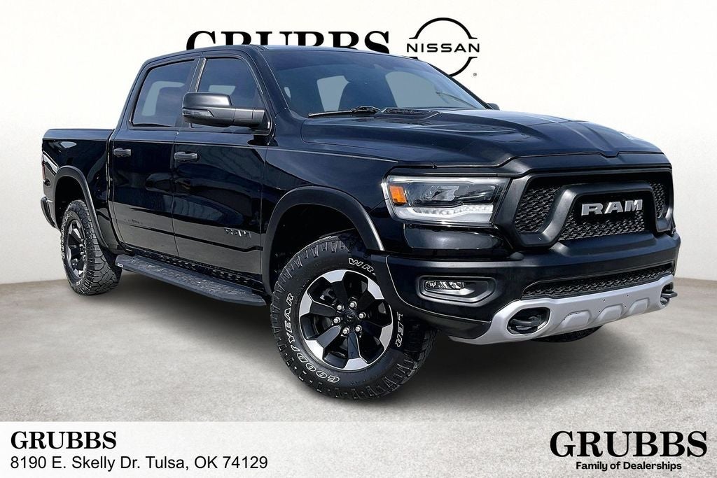 2023 RAM 1500 Rebel in Diamond Black Crystal Pearlcoat — front three-quarter view