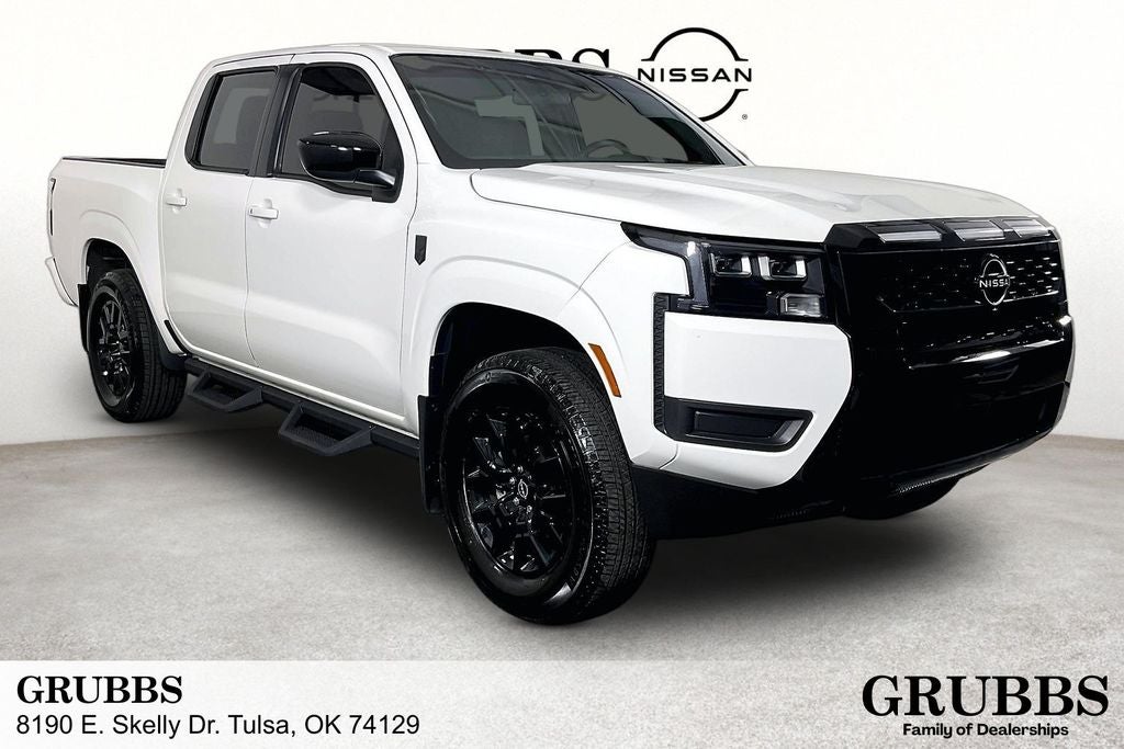 2026 Nissan Frontier SV in Glacier White — front three-quarter view