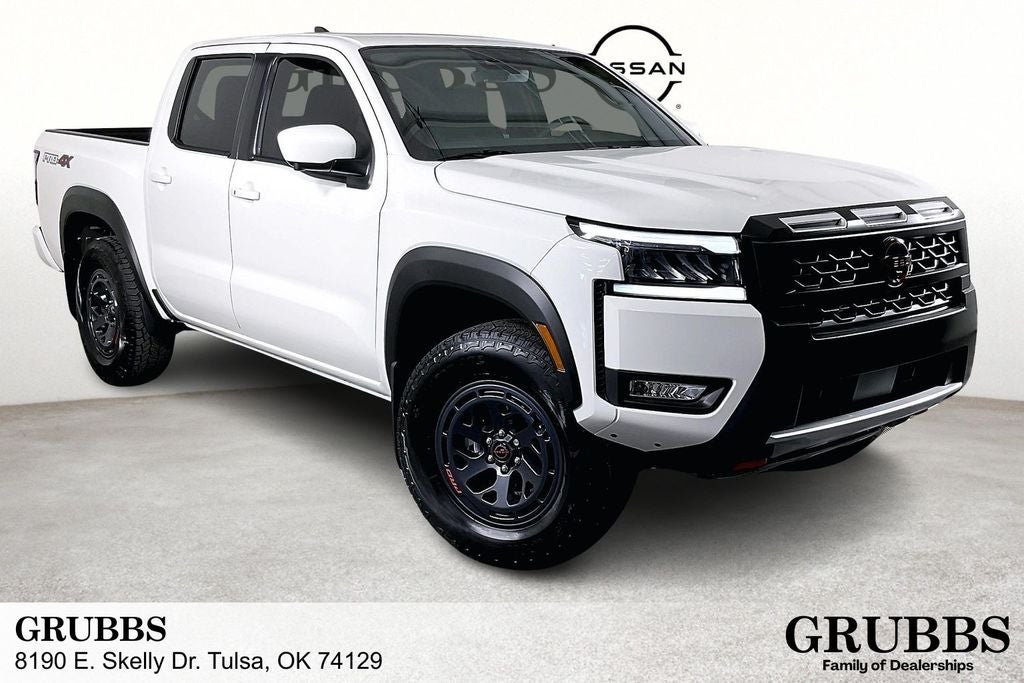 2026 Nissan Frontier Crew Cab PRO-4X in Glacier White — front three-quarter view