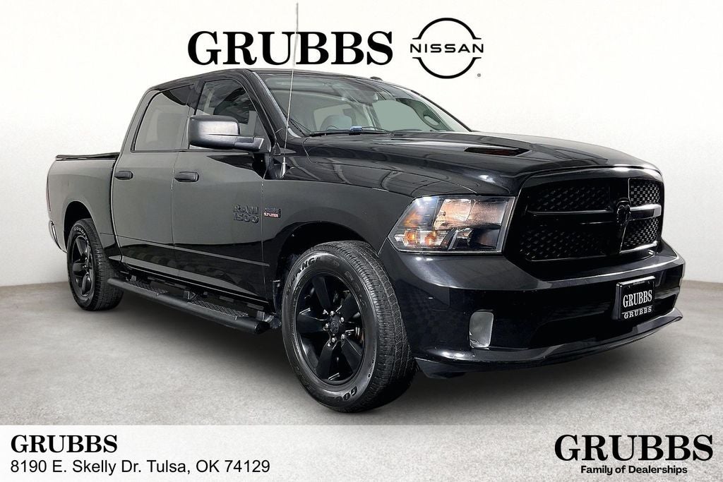 2016 RAM 1500 Express in Brilliant Black Crystal Pearlcoat — front three-quarter view