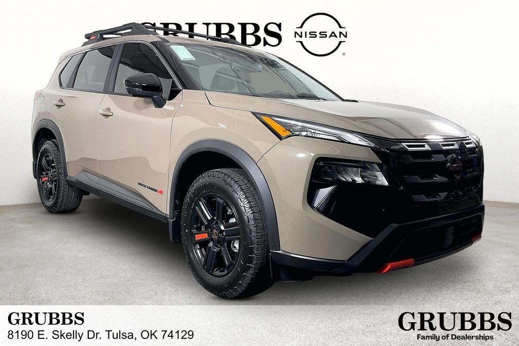 2026 Nissan Rogue Rock Creek in Baja Storm Metallic — front three-quarter view